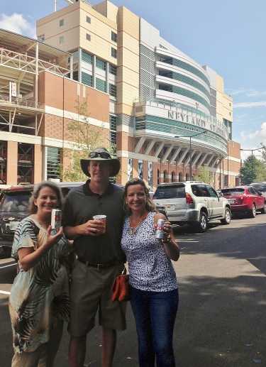 Enjoying a cold Coors Light to cheer on the Vols, from left, Beth and Jed Dance and Karen Ryan.